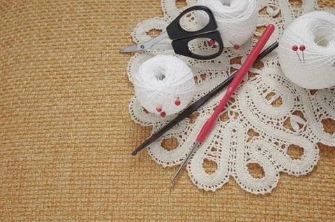 Objects for sewing. Scissors and pins. Hanks thread on mat. Pins Stock Photos