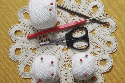 Objects for sewing. Scissors and pins. Hanks thread on mat. Pins Stock Photos