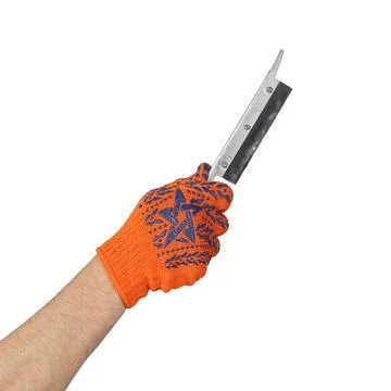 Objects tool hands action - A hand in a work glove holds a miniature saw. I.. Stock Photos