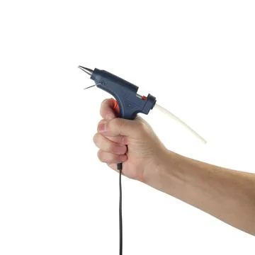 Objects tool hands action - Hand worker glue gun. Isolated Stock Photos