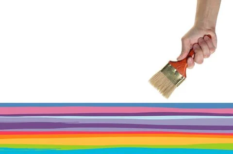 Objects tool hands action - A painter hand holds a brush and draws colored .. Stock Photos
