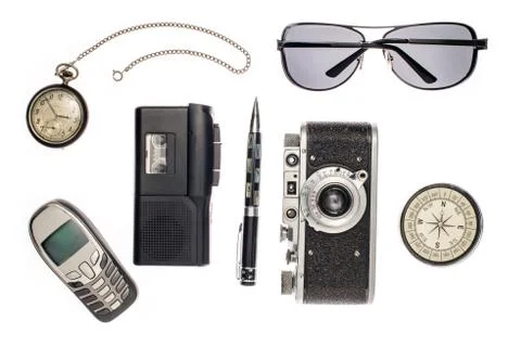 Objects for travel isolated on white background: compass, camera, tape record Foto stock