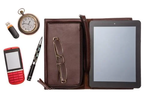 Objects for the traveler: a tablet, a flash drive, a clock, glasses, a pen, a Stock Photos