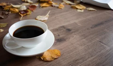 Objects on a wooden table a cup of coffee Foto stock