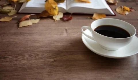 Objects on a wooden table a cup of coffee Foto stock