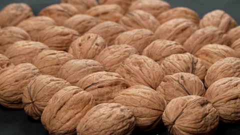 Oblique High-Angle Cinematic Pile of Whole Walnuts in Shell Video stock 332525593