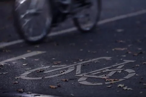 Oblique view on cycle path in early morning dawn with bicycle Stock Photos