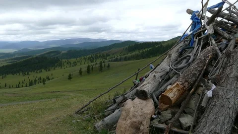 Obo (ovoo) is a sacred object in the form of a pile of rocks and a hut of logs. Stock Footage 90840971