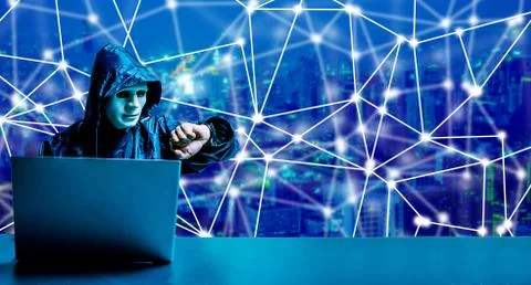 Obscured dark face using laptop computer for cyber attack and checking time 스톡 사진