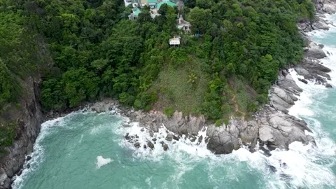 Observation deck in the jungle over the sea in a storm, view from a drone Stock Footage 166780082