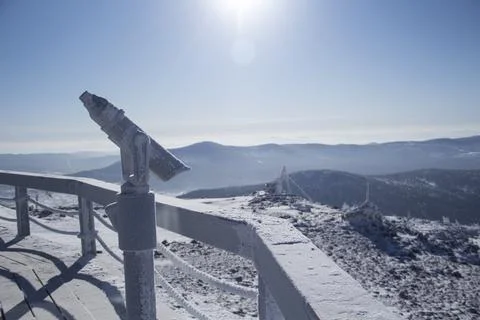 An observation deck in the mountains. Snow-capped mountains. Stock Photos