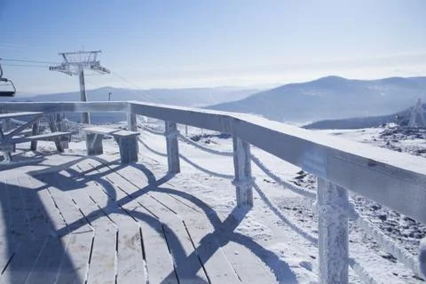 An observation deck in the mountains. Snow-capped mountains. Stock Photos