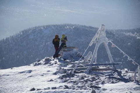 An observation deck in the mountains. Snow-capped mountains. Stock Photos