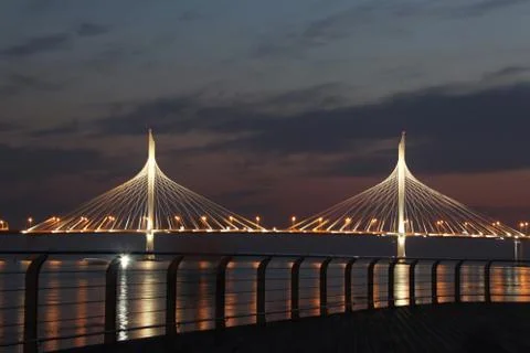 Observation deck on the shore with a view of the cable-stayed bridge and suns Stock Photos