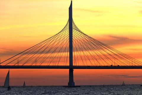 Observation deck on the shore with a view of the cable-stayed bridge and suns Stock Photos