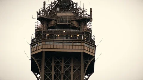 Observation deck on the top of the Eiffel tower in Paris, France. Telephoto lens Stock Footage 81158610