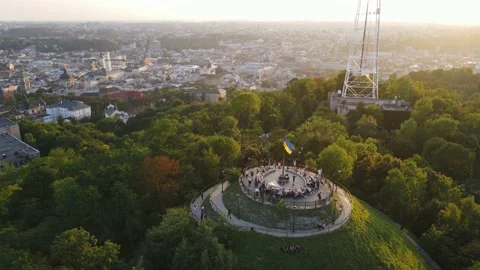 Observation deck on top of the mountain overlooking the city at sunset Stock Footage 163671971