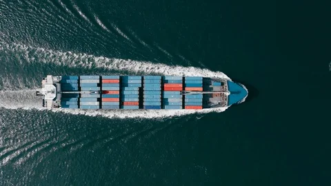 The observation of loaded cargo ship,transporting containers with freight by the Stock Footage
