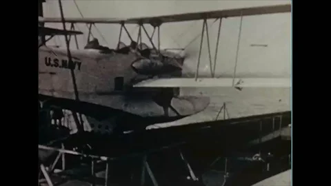 An observation seaplane is catapulted off the flight deck of a United States Stock Footage 102747843