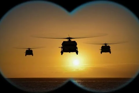 Observation through binoculars captures helicopter group in patrol zone. Stock-Fotos