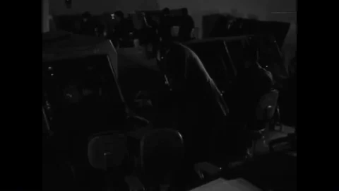 An observer confers with an aide in a weapons direction room and an airbase Stock Footage 89874187
