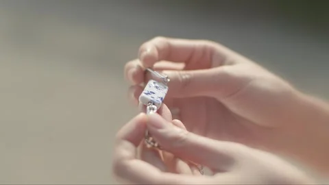 Observing the bracelet in hand Video stock 261642226