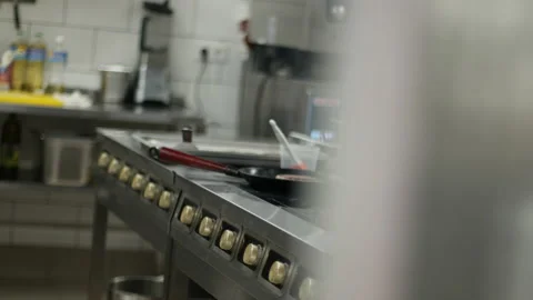 Observing a chef in a professional kitchen from around the corner. Media Stock Footage 151734563