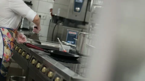 Observing a chef in a professional kitchen from around the corner. Media Stock-Footage 151734888