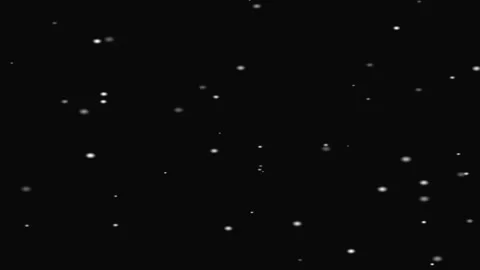 Observing Falling Dots Against a Dark Background in Slow Quiet Motion Stock Footage 328618768