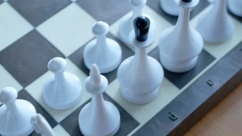 Observing inspecting troops before battle a rows of white figures on chess board 库存影片 116058475