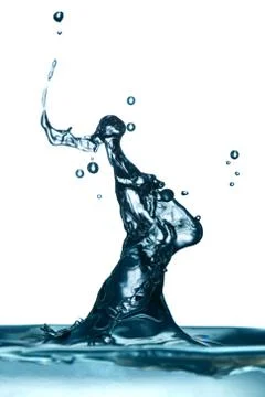 Observing the mesmerizing patterns of water shapes against a pristine white Stock Photos