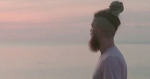 Observing ocean man with beard thinking head back view Reflections on meaning Stock Footage 274518494