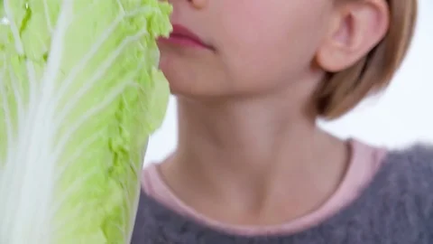 Observing radicchio and then biting into it Stock Footage 83725369