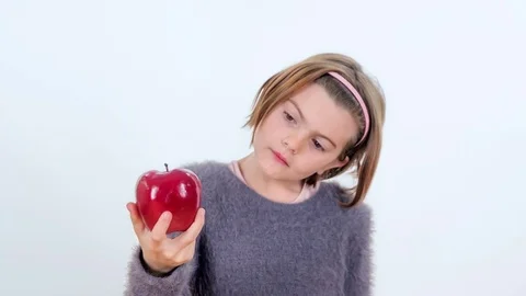 Observing a shiney red apple Stock Footage 83724750