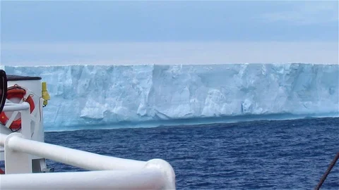 Observing tabular Iceberg at Sea from ship, Antarctica Stock Footage 125744379