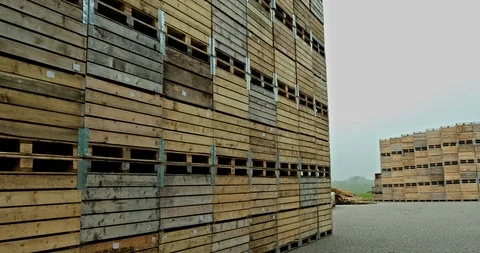 Observing view of manufacture yard with stacked wooden boxes for cattle Stockbeeldmateriaal 109379543