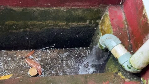 Observing Water Flow Through a Small Industrial Pipe System Stock Footage 325292308