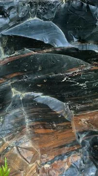 Obsidian stone background, stone wall background Stock Photos