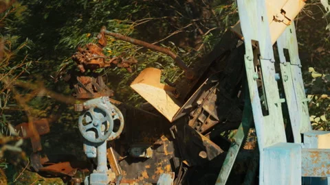 .Obsolete, abandoned, and rusty combat guns stand amidst the natural landsc.. Stock Footage 345627234