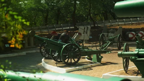 Obsolete, abandoned, and rusty combat guns stand amidst the natural landsca.. Stock-Footage 346319328