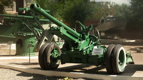 Obsolete, abandoned, and rusty combat guns stand amidst the natural landsca.. Stock-Footage 346321718