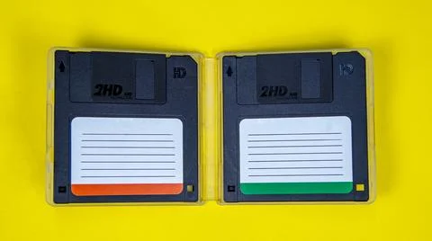 Obsolete computer floppy disks on a colored background, isolated, Foto stock