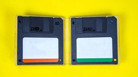 Obsolete computer floppy disks on a colored background, isolated, 写真素材