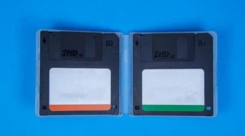Obsolete computer floppy disks on a colored background, isolated, Stock Photos