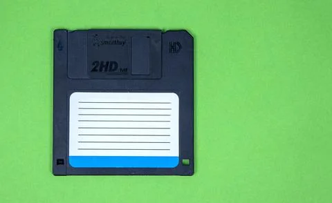 Obsolete computer floppy disks on a colored background, isolated, 库存照片