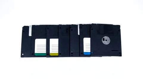 Obsolete computer floppy disks with a flash drive on a white background, 写真素材