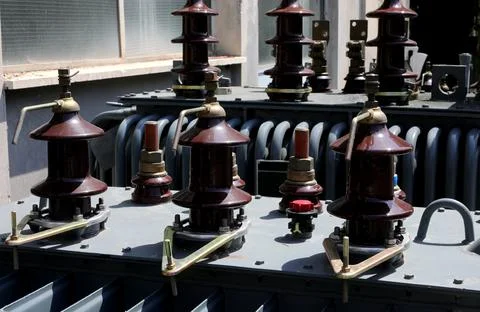 Obsolete high voltage current transformer in the warehouse of the electrical  Stockfoto's