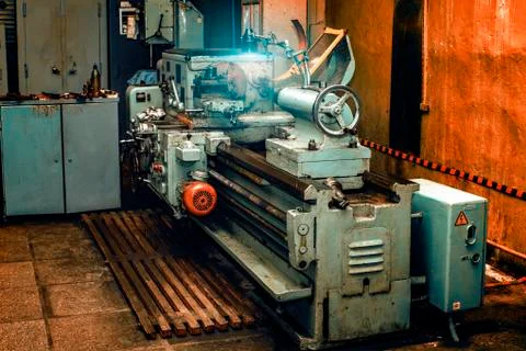 Obsolete metal lathe in an old machine shop Stock Photos