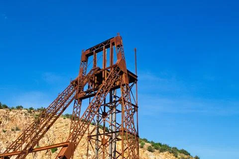 Obsolete ore extraction tower in a disused and abandoned mine Stock Photos