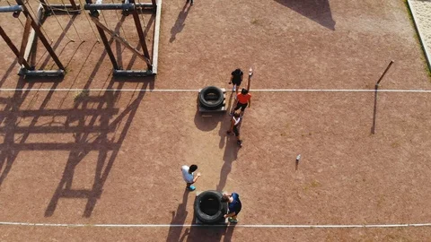 Obstace Run Training Ground - Guy Carry a Big Tire Stock Footage 92638641